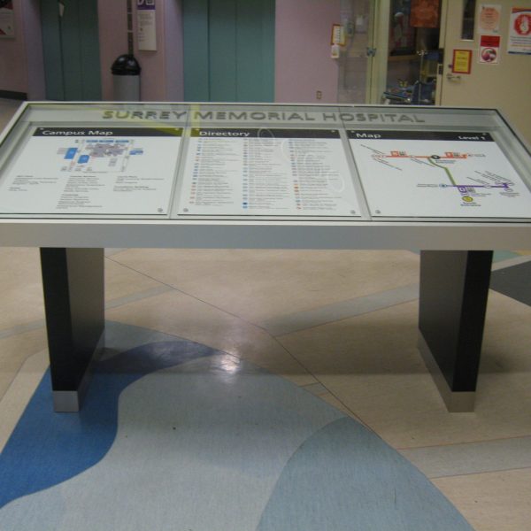 Map sign and directory sign for Surrey memorial hospital covered with the glass.