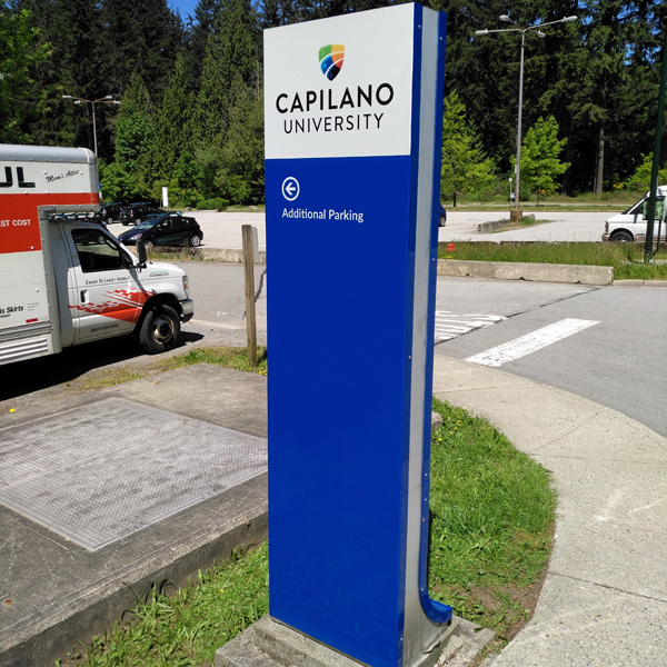 Parking sign located in the Capilano university's outdoor area
